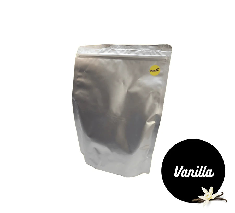 Musht Vanilla Bulk with a prepared drink